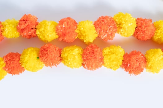 Colorful artificial marigold flower garland for festive and decorative celebrations. photo