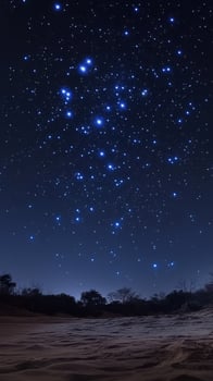 Stars fill the night sky above a serene landscape in a remote area photo