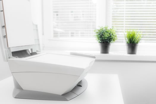 White home printer on white table near the window photo
