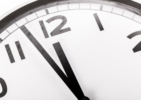 Close up of a wall clock. Time management concept photo