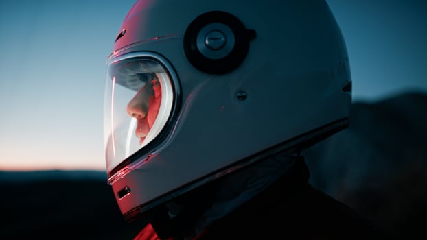 Astronaut With Helmet Explores New Desolate Planet At Night Out Of Spaceship photo