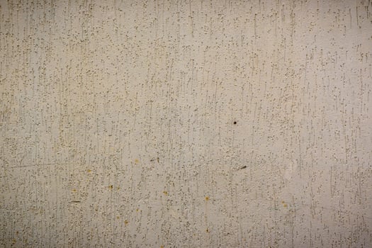 Textured wall with subtle hues showcasing the beauty of simplicity and raw materials in urban environments photo