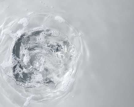 Water Vortex with Bubbles and Concentric Ripples photo