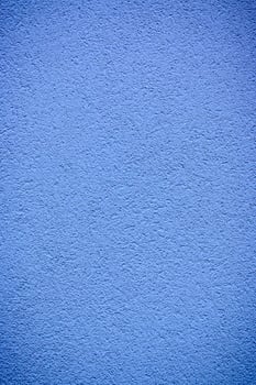 Vibrant blue wall texture inviting creativity under bright daylight photo