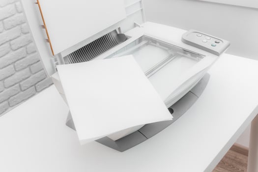 White home printer on white table near the window photo