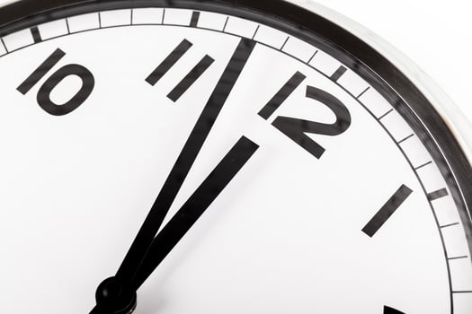 Close up of a wall clock. Time management concept photo