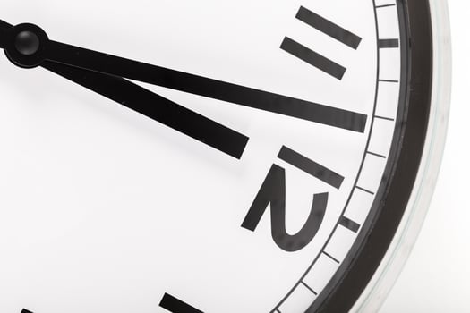 Close up of a wall clock. Time management concept photo