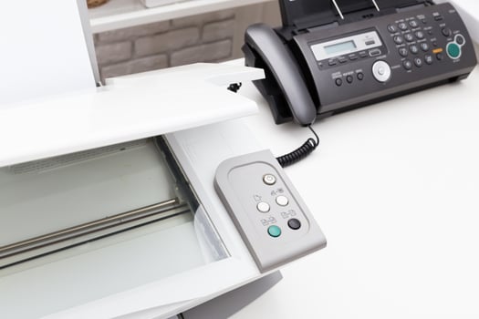 Printer and fax machine on office table photo