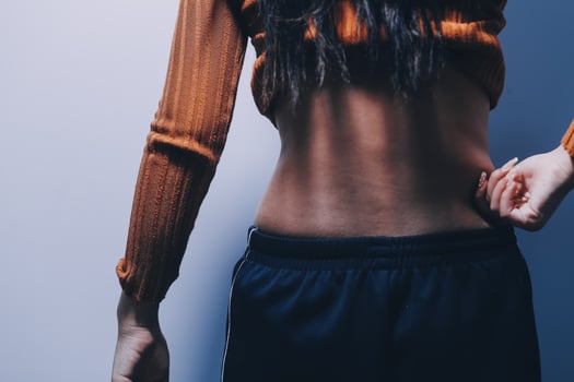 A woman with her hands on her hips photo