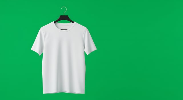 White t - shirt hanging on a hanger on a green background photo