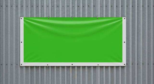 Green blank billboard on metal wall photo