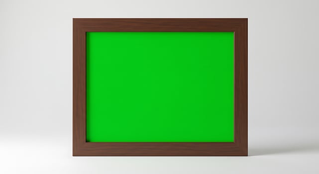 A green screen in a wooden frame on a white background photo