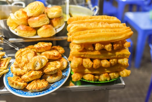 pastries with custard cream in night market of street food in Da Lat in Vietnam photo