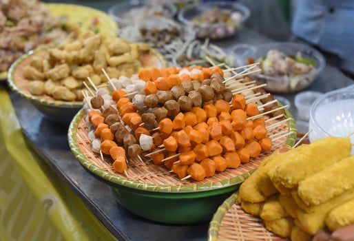 Many snack and sea food in vietnamese night market in food festival photo