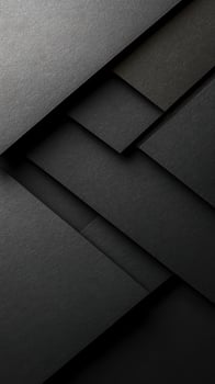 Textured layers of black paper create a modern abstract design ideal for backgrounds or art projects photo
