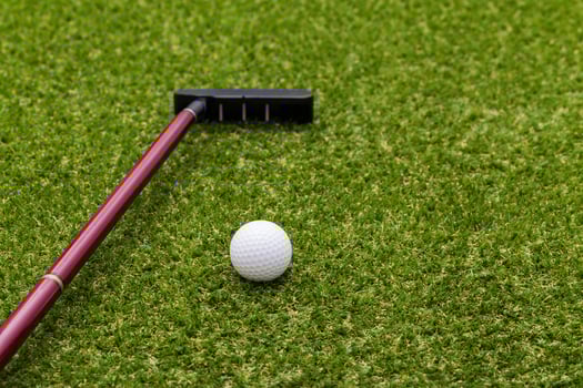 Close up of mini golf equipment on grass photo