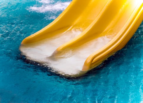 Yellow water slide in the water park photo
