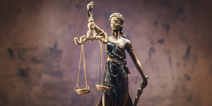 Statue of lady justice holding scales and scales photo