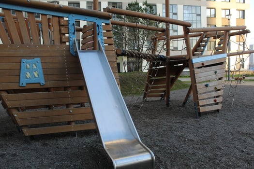Metal slide on the playground. Modern courtyard photo