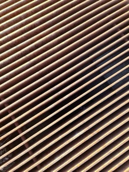 Rusty metal grate forming parallel lines creating an interesting visual pattern photo