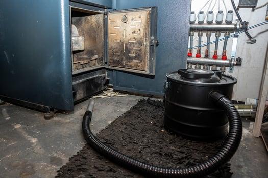 Utility Room with Furnace, Vacuum Cleaner, and Pipe Manifold System photo