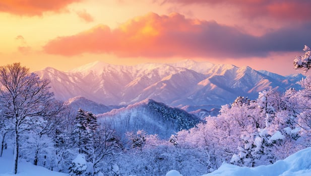 A serene winter landscape with mountains and snow-covered trees at sunset. photo