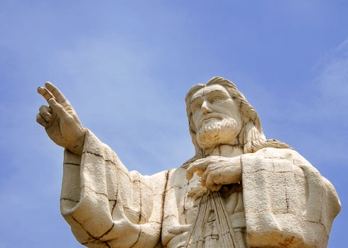 Statue of Jesus of Mercy on the beaches of San Juan del Sur, Nicaragua. photo