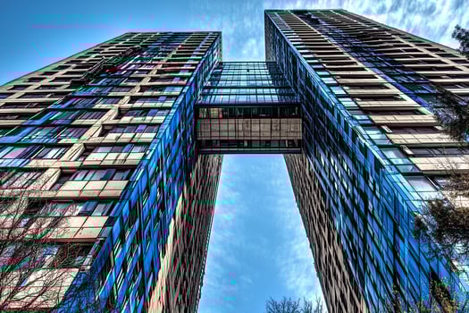 A low angle view of modern skyscrapers in London, highlighting the impressive architecture and towering buildings of the city's financial district. photo