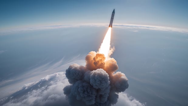 A rocket is taking off into the sky photo