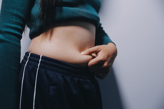 A woman with her stomach exposed photo