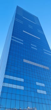 Blue skyscraper with blue sky on the background photo