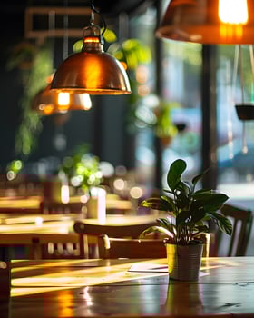 Cafe Interior with Pendant Lighting and Potted Plant photo