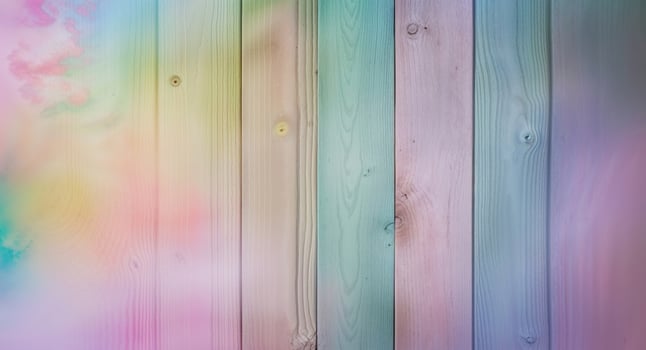 A wooden wall with a rainbow colored paint on it photo