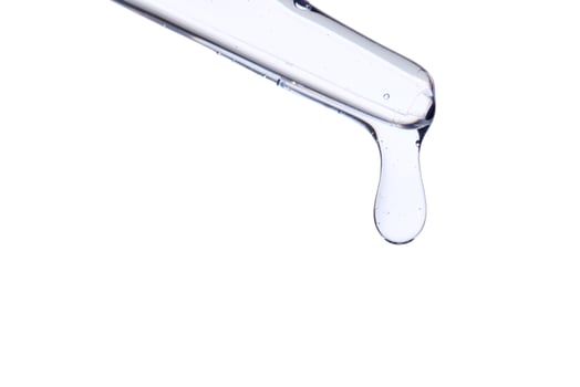 Pipette with delicate blue serum close-up. photo