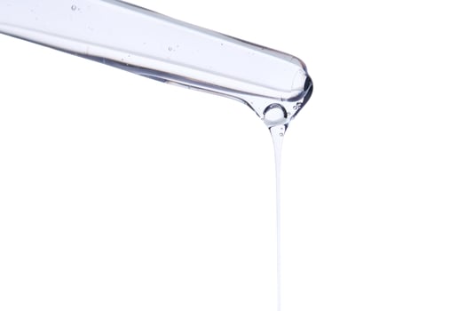 Pipette with delicate blue serum close-up. photo