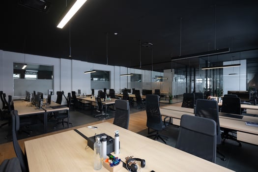 Modern business, glass-walled startup office, open and spacious workspace exudes a modern and innovative vibe, fostering a dynamic atmosphere that supports creativity, collaboration, and business photo