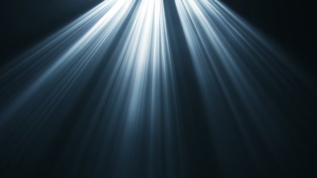 Rays of light cascade from above, piercing the darkness with ethereal illumination, creating a serene and atmospheric ambiance. photo