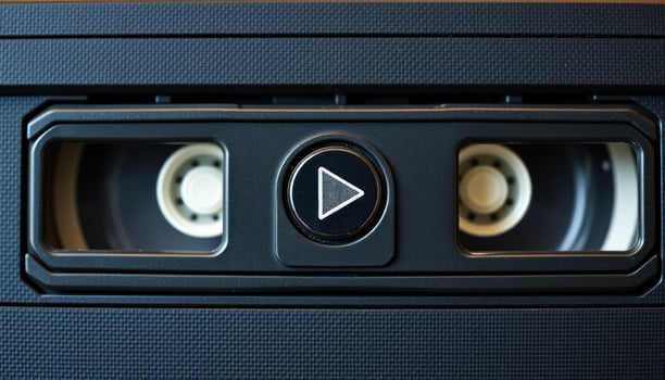 Close-Up of a VHS Cassette Tape with Play Button photo
