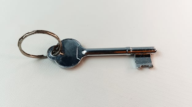 Antique house key isolated on background. photo