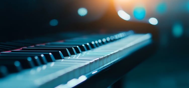 Close-up of piano keys in a dimly lit room. photo