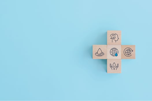 Wooden block with icons for World Water Day. accelerating change and every drop matters. Saving water and world environmental protection concept. clean renewable energy. water for peace. photo