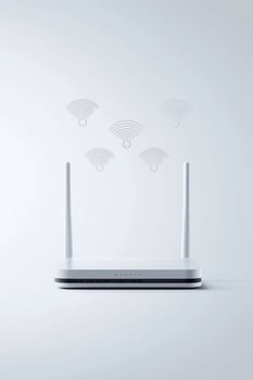Modern white wi-fi router with antennas and signal waves on minimalist background photo