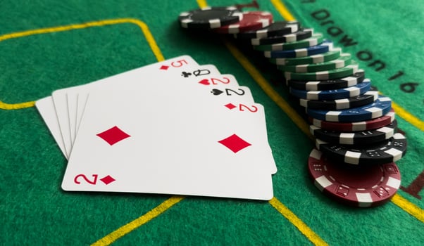 A popular and exciting poker game with a winning combination. Playing cards and chips on a table in a poker club. Advertising space. photo
