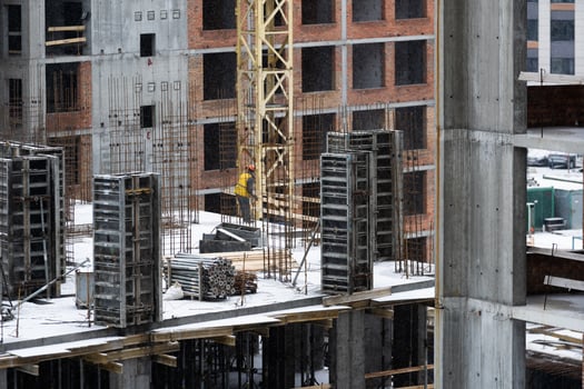 Construction site background. Hoisting cranes and new multi-storey buildings. Industrial background. photo