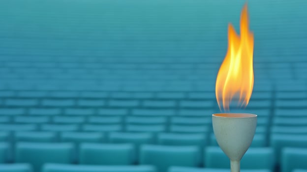 Burning Torch in Empty Stadium Symbol of Hope, Athletic Spirit, and Perseverance photo