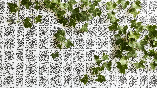 Patterned Black and White Tile with Green Ivy Vines for Modern NatureInspired Decor photo