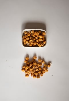 Caramel popcorn on a white background photo