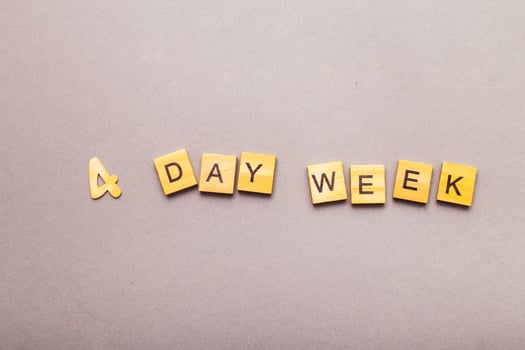 inscription four day week making by wooden cubes photo