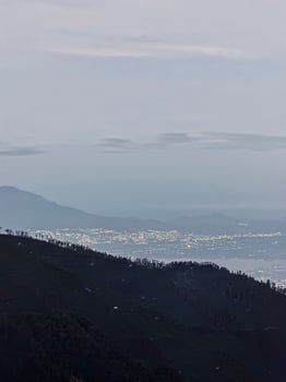 Mountain Landscape with City Lights at Dusk. Bromo National Park. photo