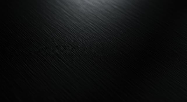 Black metal texture background with a shiny surface photo